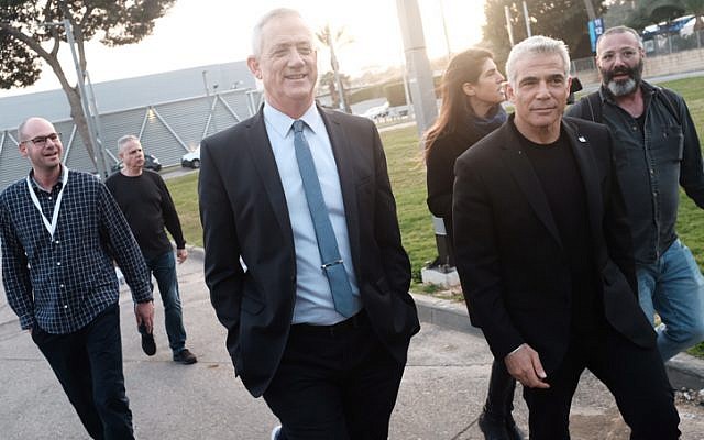 Benny Gantz (C) and Yair Lapid (R), leaders of the Blue and White political alliance, arrive to hold a press conference in Tel Aviv on March 21, 2019. (Tomer Neuberg/Flash90) Benny Gantz (C) and Yair Lapid (R), leaders of the Blue and White political alliance, arrive to hold a press conference in Tel Aviv on March 21, 2019. (Tomer Neuberg/Flash90)