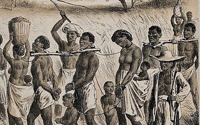Illustrative: A lithograph, circa 1880, of a group of men, women, and children being taken to a slave market. (Wellcome collection)