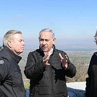 US Senator Lindsey Graham, left, Prime Minister Benjamin Netanyahu, center, and US Ambassador to Israel David Friedman, right, on a tour of the Golan Heights, March 11, 2019. (Amos Ben Gershom/GPO)