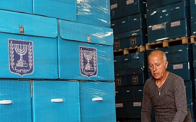 Central Election Committee workers prepare materials to be sent to polling stations ahead of election day, March 6, 2019. (Raoul Wootliff/Times of Israel)