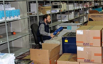 Central Election Committee workers prepare materials to be sent to polling stations ahead of election day, March 6, 2019. (Raoul Wootliff/Times of Israel)