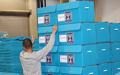 Central Election Committee workers prepare materials to be sent to polling stations ahead of election day, March 6, 2019. (Raoul Wootliff/Times of Israel)
