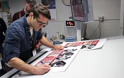 Author Jamie Michaels (foreground) and illustrator Doug Fedrau working on 'Christie Pits' at Friesens in Altona, Manitoba. (Alex Michaels)