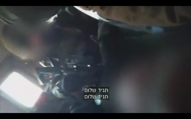 A since-convicted IDF soldier strikes a Palestinian prisoner in a military jeep in January 2019. (Screenshot) A since-convicted IDF soldier strikes a Palestinian prisoner in a military jeep in January 2019. (Screenshot)