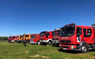 Israeli and Palestinian firetrucks in Jenin on March 19, 2019. (Credit: COGAT)