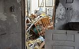 Police inspect a home in the central Israeli town of Mishmeret that was destroyed in a rocket attack from the Gaza Strip on March 25, 2019. (Israel Police)