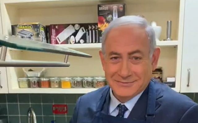 Prime Minister Benjamin Netanyahu fries eggs in an election video, March 2019. (Screen grab via Facebook) Prime Minister Benjamin Netanyahu fries eggs in an election video, March 2019. (Screen grab via Facebook)
