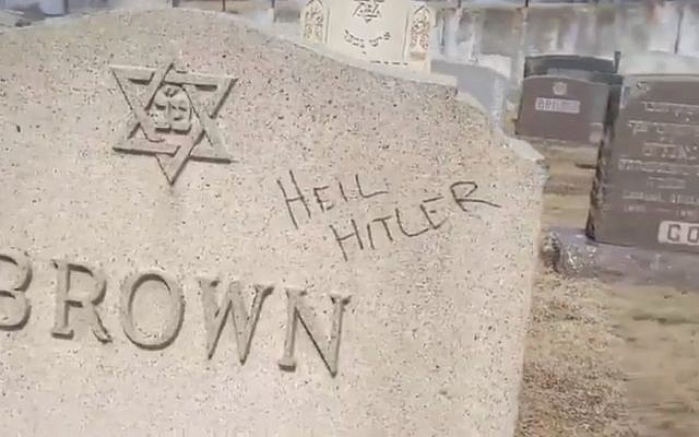 A defaced gravestone at a Jewish cemetery in Fall River, Massachusetts, in a video published on March 20, 2019. (screen capture: Washington Post) A defaced gravestone at a Jewish cemetery in Fall River, Massachusetts, in a video published on March 20, 2019. (screen capture: Washington Post)