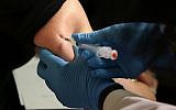 A woman receives a measles, mumps and rubella vaccine at the Rockland County Health Department in Pomona, NY, March 27, 2019. (Seth Wenig/AP)
