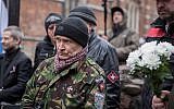 A man taking part in a march to honor member of the Latvian Legion SS units in Riga, Latvia, on March 16, 2019. (Courtesy: JFDA e.V. / Grischa Stanjek(