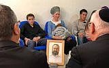 President Reuven Rivlin (right, back to camera) visits on March 20, 2019, the family of Rabbi Achiad Ettinger, one of two Israelis killed in a Palestinian terror attack on March 17. (President's spokesperson)