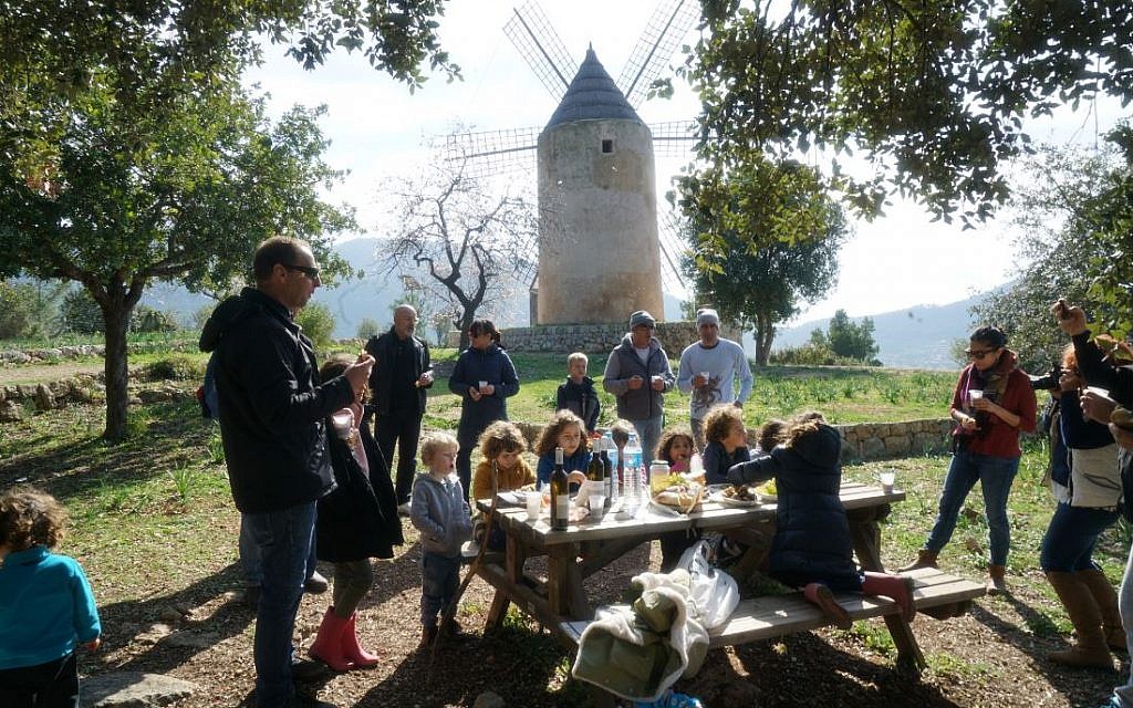 Illustrative: Members of the modern-day Jewish community of Mallorca, Spain, celebrate Tu b'Shvat, February 10, 2019. (Cnaan Liphshiz)