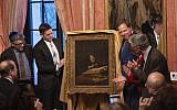 The 1639 painting by Salomon Koninck titled "A Scholar Sharpening His Quill" looted by the Nazis from the Schloss family during World War II, is unveiled on April 1, 2019 at the French Consulate in New York City. (Photo by Don Emmert / AFP)