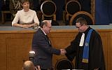 Estonian President Kersti Kaljulaid (top L) looks on as Mart Helme (C), chairman of the far-right Estonian ERKE party, takes the oath during the Estonian parliament Riigikogu's first opening sitting after elections on April 4, 2019 in Tallinn.  (Raigo PAJULA / AFP)