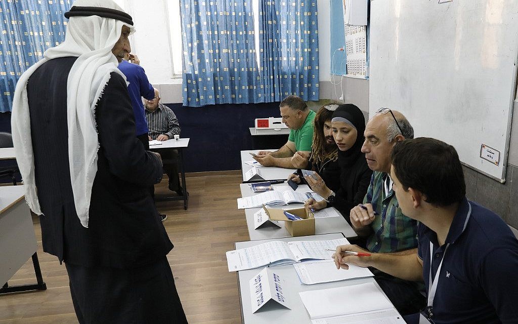 An Arab Israeli man prepares to vote in Israel's parliamentary elections on April 9, 2019, at a school-turned-polling station in the northern Israeli town of Taibe. (Ahmad Gharabli/AFP)