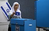 An Arab Israeli woman casts her vote during Israel's parliamentary elections on April 9, 2019, in Daliyat al-Carmel in northern Israel. (Jalaa Marey/AFP)