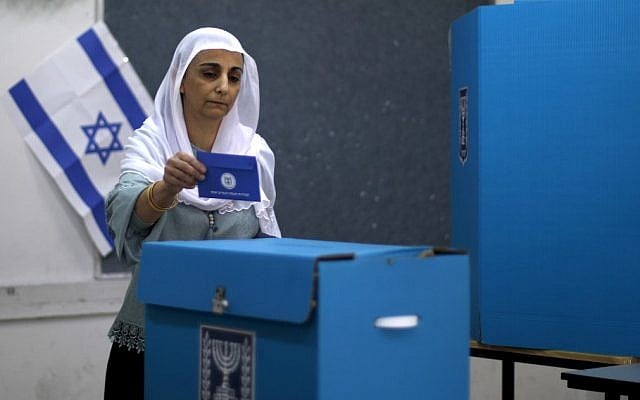 An Arab Israeli woman casts her vote during Israel's parliamentary elections on April 9, 2019, in Daliyat al-Carmel in northern Israel. (Jalaa Marey/AFP) An Arab Israeli woman casts her vote during Israel's parliamentary elections on April 9, 2019, in Daliyat al-Carmel in northern Israel. (Jalaa Marey/AFP)