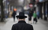 Illustrative: A Jewish man crosses a street in a Haredi Jewish area in Williamsburg, Brooklyn on April 9, 2019 in New York City. (Johannes Eisele/AFP)