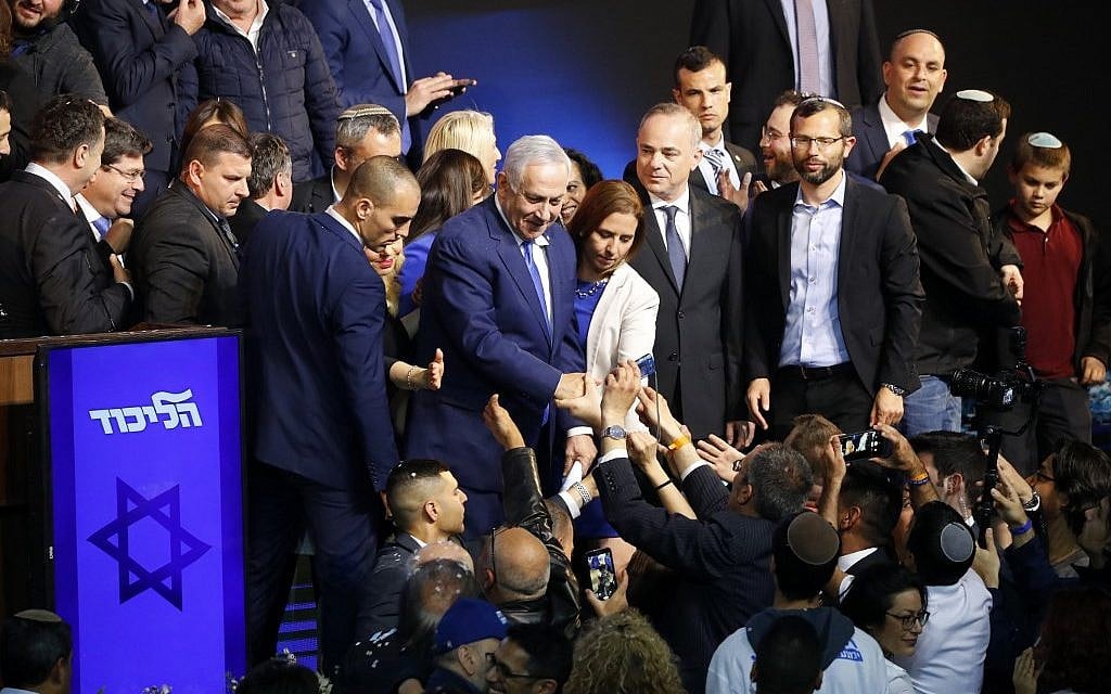 Israeli Prime Minister Benjamin Netanyahu (C) greets supporters at his Likud Party headquarters in the Israeli coastal city of Tel Aviv on election night early on April 10, 2019. (Photo by Jack GUEZ / AFP) Israeli Prime Minister Benjamin Netanyahu (C) greets supporters at his Likud Party headquarters in the Israeli coastal city of Tel Aviv on election night early on April 10, 2019. (Photo by Jack GUEZ / AFP)