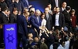 Israeli Prime Minister Benjamin Netanyahu (C) greets supporters at his Likud Party headquarters in the Israeli coastal city of Tel Aviv on election night early on April 10, 2019. (Photo by Jack GUEZ / AFP)
