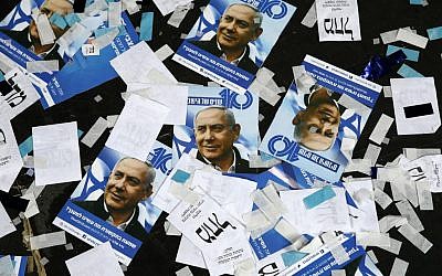 Likud party campaign material and posters of Prime Minister Benjamin Netanyahu strewn on the floor following election night at the party's Tel Aviv headquarters, April 10, 2017. (Jack Guez/AFP)