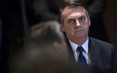 Brazilian President Jair Bolsonaro attends a meeting with evangelical leaders at the Hilton Barra Hotel, in Barra da Tijuca neighborhood, Rio de Janeiro, Brazil on April 11, 2019. (Mauro Pimentel / AFP)