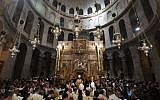 Roman Catholic Archbishop Pierbattista Pizzaballa (center), leads the Easter Sunday procession at the Church of the Holy Sepulchre in Jerusalem's Old City on April 21, 2019. (GALI TIBBON / AFP)