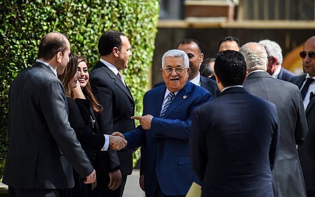 Palestinian Authority President Mahmoud Abbas (C) is greeted upon his arrival at the Arab League headquarters in the Egyptian capital Cairo, to discuss the latest developments in the Palestinian territories on April 21, 2019. (MOHAMED EL-SHAHED / AFP) Palestinian Authority President Mahmoud Abbas (C) is greeted upon his arrival at the Arab League headquarters in the Egyptian capital Cairo, to discuss the latest developments in the Palestinian territories on April 21, 2019. (MOHAMED EL-SHAHED / AFP)
