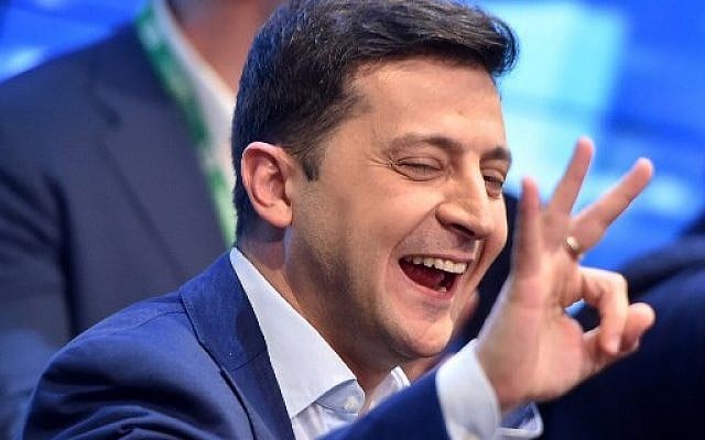 Ukrainian comedian and presidential candidate Volodymyr Zelensky reacts after the announcement of the first exit poll results in the second round of Ukraine's presidential election at his campaign headquarters in Kiev on April 21, 2019. (Sergei Gapon/AFP) Ukrainian comedian and presidential candidate Volodymyr Zelensky reacts after the announcement of the first exit poll results in the second round of Ukraine's presidential election at his campaign headquarters in Kiev on April 21, 2019. (Sergei Gapon/AFP)