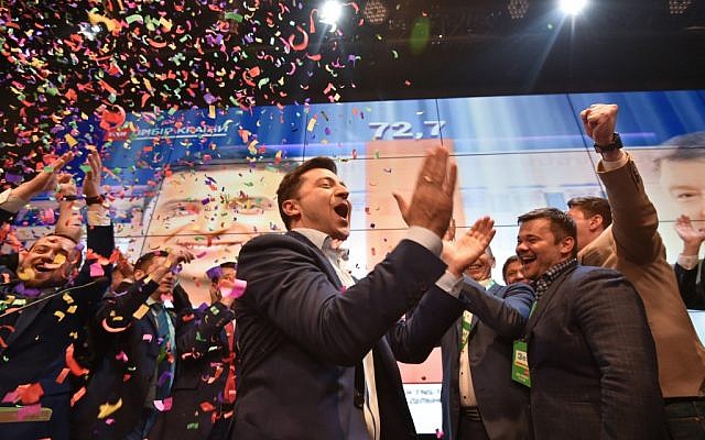 Ukrainian comedian and presidential candidate Volodymyr Zelensky reacts after the announcement of the first exit poll results in the second round of Ukraine's presidential election, at his campaign headquarters in Kiev, on April 21, 2019. (Genya Savilov/AFP) Ukrainian comedian and presidential candidate Volodymyr Zelensky reacts after the announcement of the first exit poll results in the second round of Ukraine's presidential election, at his campaign headquarters in Kiev, on April 21, 2019. (Genya Savilov/AFP)