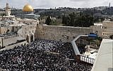 Jewish worshipers take part in the priestly blessing during the Passover holiday at the Western Wall in the Old City of Jerusalem on April 22, 2019. (Thomas COEX / AFP)