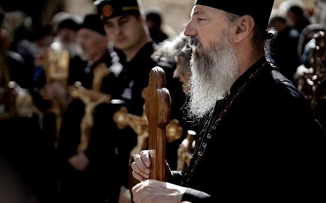 Orthodox Christians from Serbia celebrate the Good Friday in procession on Via Dolorosa in the Old City of Jerusalem, on April 26, 2019. (THOMAS COEX / AFP)