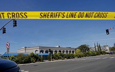 Illustrative photo: Sheriff's crime scene tape is placed in front of the Chabad of Poway Synagogue, after a shooting on April 27, 2019, in Poway, California. (Sandy Huffaker/AFP)