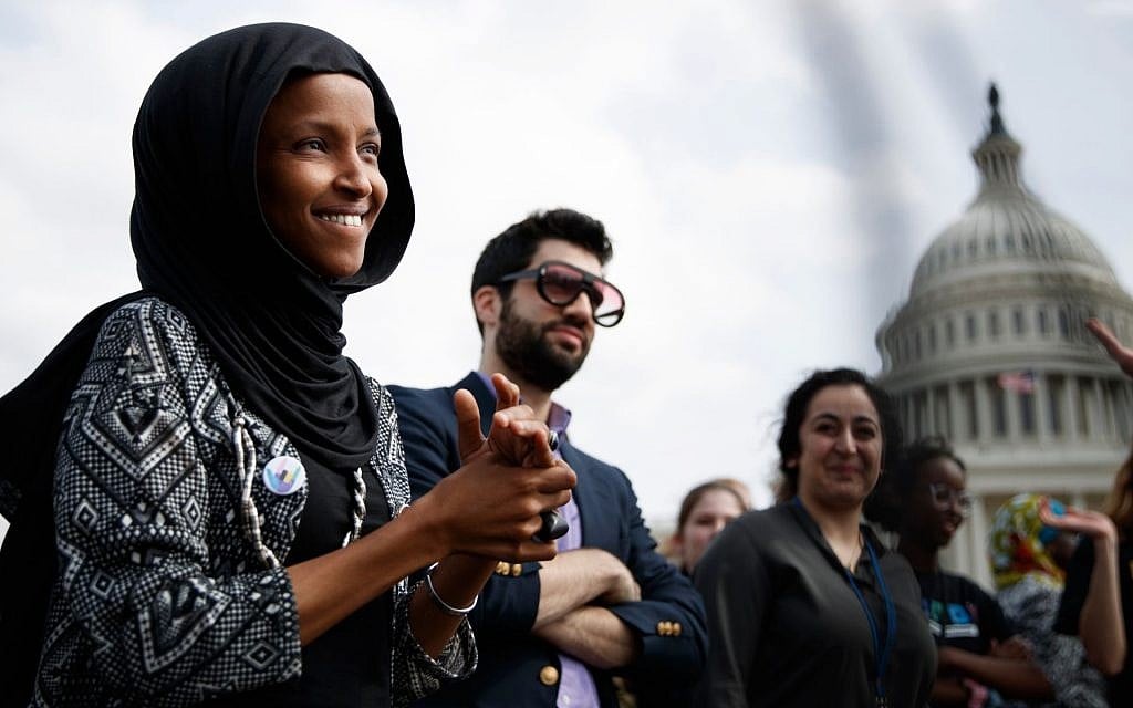 Jeremy Slevin, center, standing next to Ilhan Omar, left, at a protest in Washington on March 15, 2019. (Tom Brenner/Getty Images) Jeremy Slevin, center, standing next to Ilhan Omar, left, at a protest in Washington on March 15, 2019. (Tom Brenner/Getty Images)
