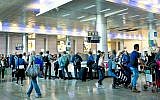Illustrative: Travelers at Ben-Gurion Airport in Tel Aviv in 2018. (Moshe Shai/Flash90/File)
