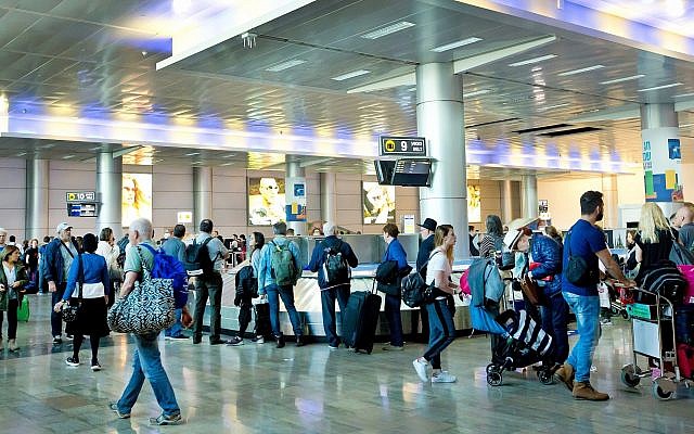 Illustrative: Travelers at Ben-Gurion Airport in Tel Aviv in 2018. (Moshe Shai/Flash90/File)