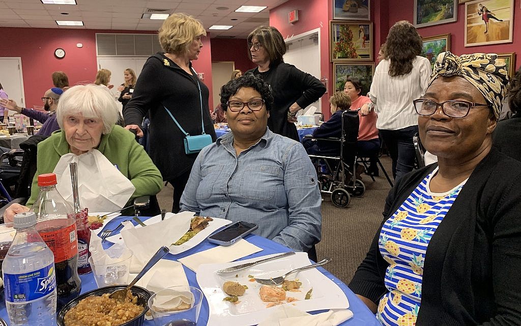 Charlotte Schwimmer, left, was accompanied by caretakers Sharon Williams, center, and Opal Rochester. (Josefin Dolsten)