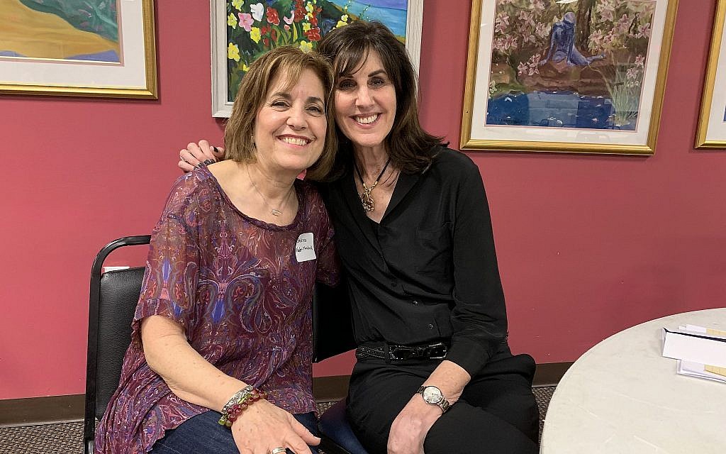 Ellen Grossman, right, pictured with volunteer Barbara Feder, has been organizing the seder for nine years. (Josefin Dolsten)
