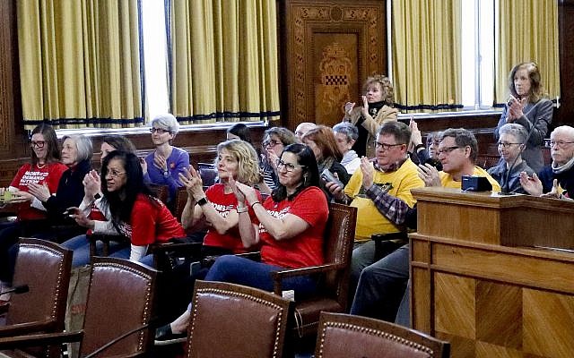 People in attendance applaud after the Pittsburgh City Council voted 6-3 to pass gun-control legislation, Tuesday, April 2, 2019, in Pittsburgh. The bill, introduced in the wake of the synagogue massacre last October, places restrictions on military-style assault weapons like the AR-15 rifle that authorities say was used in the attack that killed 11 and wounded seven. (AP Photo/Keith Srakocic) People in attendance applaud after the Pittsburgh City Council voted 6-3 to pass gun-control legislation, Tuesday, April 2, 2019, in Pittsburgh. The bill, introduced in the wake of the synagogue massacre last October, places restrictions on military-style assault weapons like the AR-15 rifle that authorities say was used in the attack that killed 11 and wounded seven. (AP Photo/Keith Srakocic)