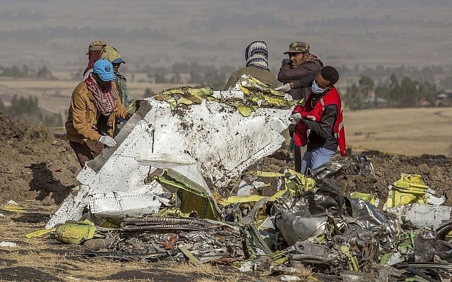 In this March 11, 2019, file photo, rescuers work at the scene of an Ethiopian Airlines flight crash near Bishoftu, Ethiopia. (AP Photo/Mulugeta Ayene, File) In this March 11, 2019, file photo, rescuers work at the scene of an Ethiopian Airlines flight crash near Bishoftu, Ethiopia. (AP Photo/Mulugeta Ayene, File)