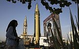 In this September 24, 2017 file photo, surface-to-surface missiles and a portrait of the Iranian Supreme Leader Ayatollah Ali Khamenei are displayed by the Revolutionary Guard. (AP Photo/Vahid Salemi)