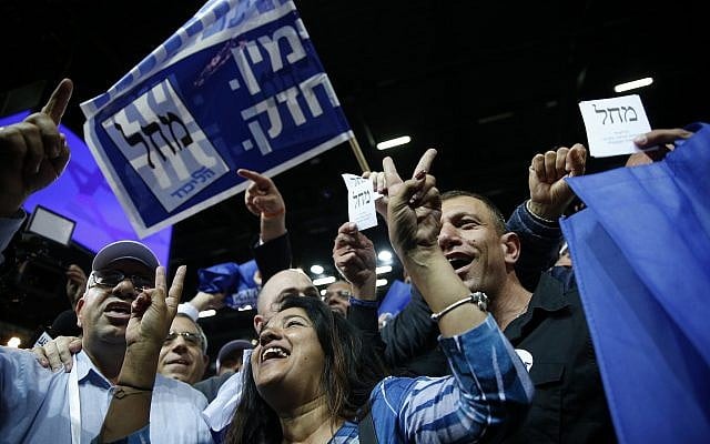Likud party supporters cheer at the party's campaign headquarters after polls close in Knesset elections, in Tel Aviv, in the early hours of April 10, 2019. (AP Photo/Ariel Schalit) Likud party supporters cheer at the party's campaign headquarters after polls close in Knesset elections, in Tel Aviv, in the early hours of April 10, 2019. (AP Photo/Ariel Schalit)