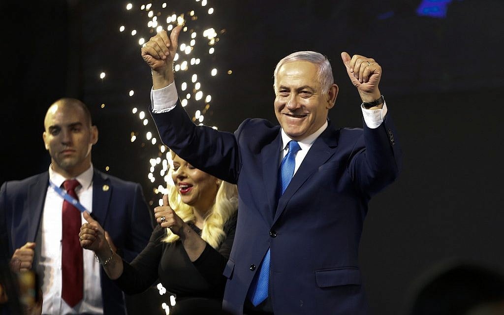 Prime Minister Benjamin Netanyahu waves to supporters at a victory celebration after polls for general elections closed in Tel Aviv, April 9, 2019. (AP Photo/Ariel Schalit) Prime Minister Benjamin Netanyahu waves to supporters at a victory celebration after polls for general elections closed in Tel Aviv, April 9, 2019. (AP Photo/Ariel Schalit)
