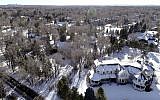 This Jan. 3, 2019 photo shows snow covered Swastika Acres in Englewood, Colorado. (Hyoung Chang/The Denver Post via AP)