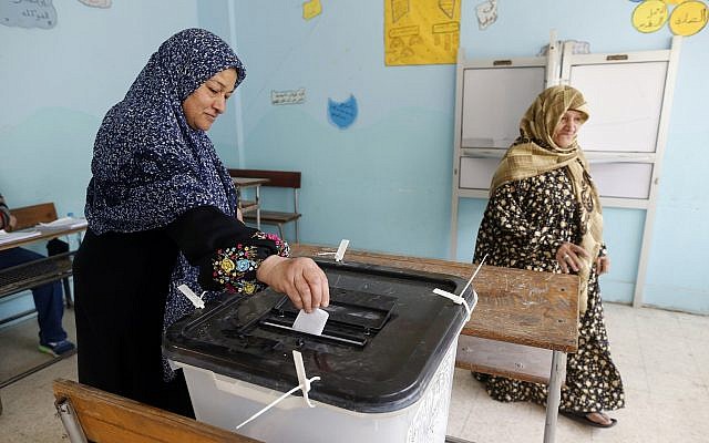 A voter casts her ballot at polling station in Cairo, Egypt, April 21, 2019 on constitutional amendments that would allow President Abdel-Fattah el-Sissi to stay in power until 2030. (AP/Amr Nabil) A voter casts her ballot at polling station in Cairo, Egypt, April 21, 2019 on constitutional amendments that would allow President Abdel-Fattah el-Sissi to stay in power until 2030. (AP/Amr Nabil)