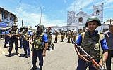 Sri Lankan Army soldiers secure the area around St. Anthony Shrine after a blast in Colombo, Sri Lanka, Sunday, April 21, 2019 (AP Photo/Chamila Karunarathne)