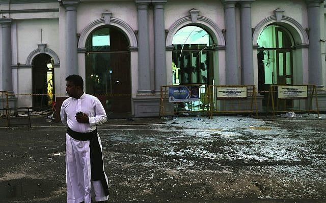 A Sri Lankan catholic priest stands near broken glass in front St. Anthony's Church in Colombo, Sri Lanka, Friday, April 26, 2019. Priests have allowed journalists inside St. Anthony's Church in Sri Lanka for the first time since it was targeted in a series of Islamic State-claimed suicide bombings that killed over 250 people. (AP Photo/Manish Swarup) A Sri Lankan catholic priest stands near broken glass in front St. Anthony's Church in Colombo, Sri Lanka, Friday, April 26, 2019. Priests have allowed journalists inside St. Anthony's Church in Sri Lanka for the first time since it was targeted in a series of Islamic State-claimed suicide bombings that killed over 250 people. (AP Photo/Manish Swarup)
