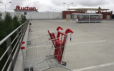 In this July 12, 2009 file, the empty parking lot of an Auchan hypermarket is seen in Plaisir, France. (AP Photo/Remy de la Mauviniere, File)