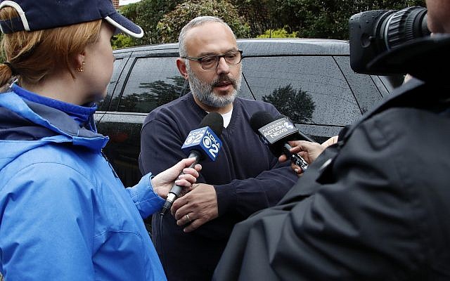 Jeff Finkelstein, center, president and CEO of the Jewish Federation of Greater Pittsburgh, is interviewed several blocks from the Tree of Life Synagogue on October 27, 2018. (AP Photo/ Gene J. Puskar) Jeff Finkelstein, center, president and CEO of the Jewish Federation of Greater Pittsburgh, is interviewed several blocks from the Tree of Life Synagogue on October 27, 2018. (AP Photo/ Gene J. Puskar)