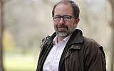 Keir Giles, a Russia specialist with Britain’s Chatham House think tank, poses for a photo in central London on Thursday, Feb. 28, 2019. (AP Photo/Frank Augstein)